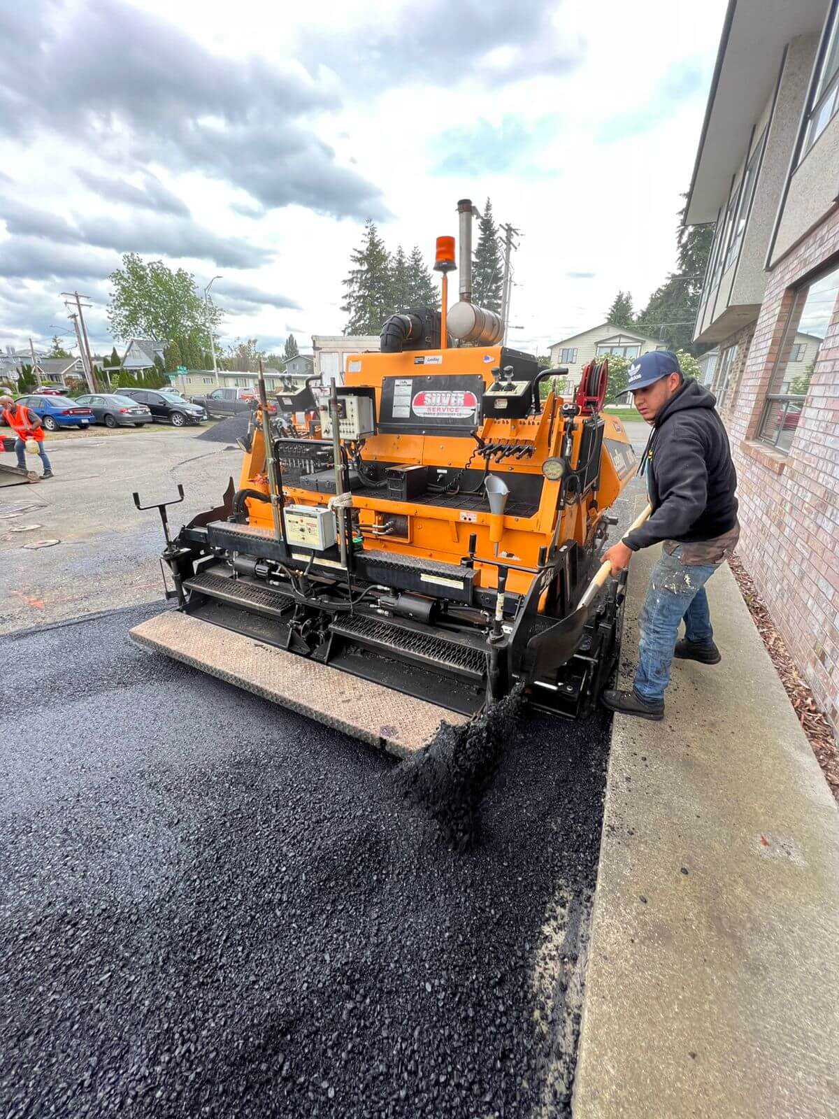 asphalt - Paving Worker Spreading Asphalt
